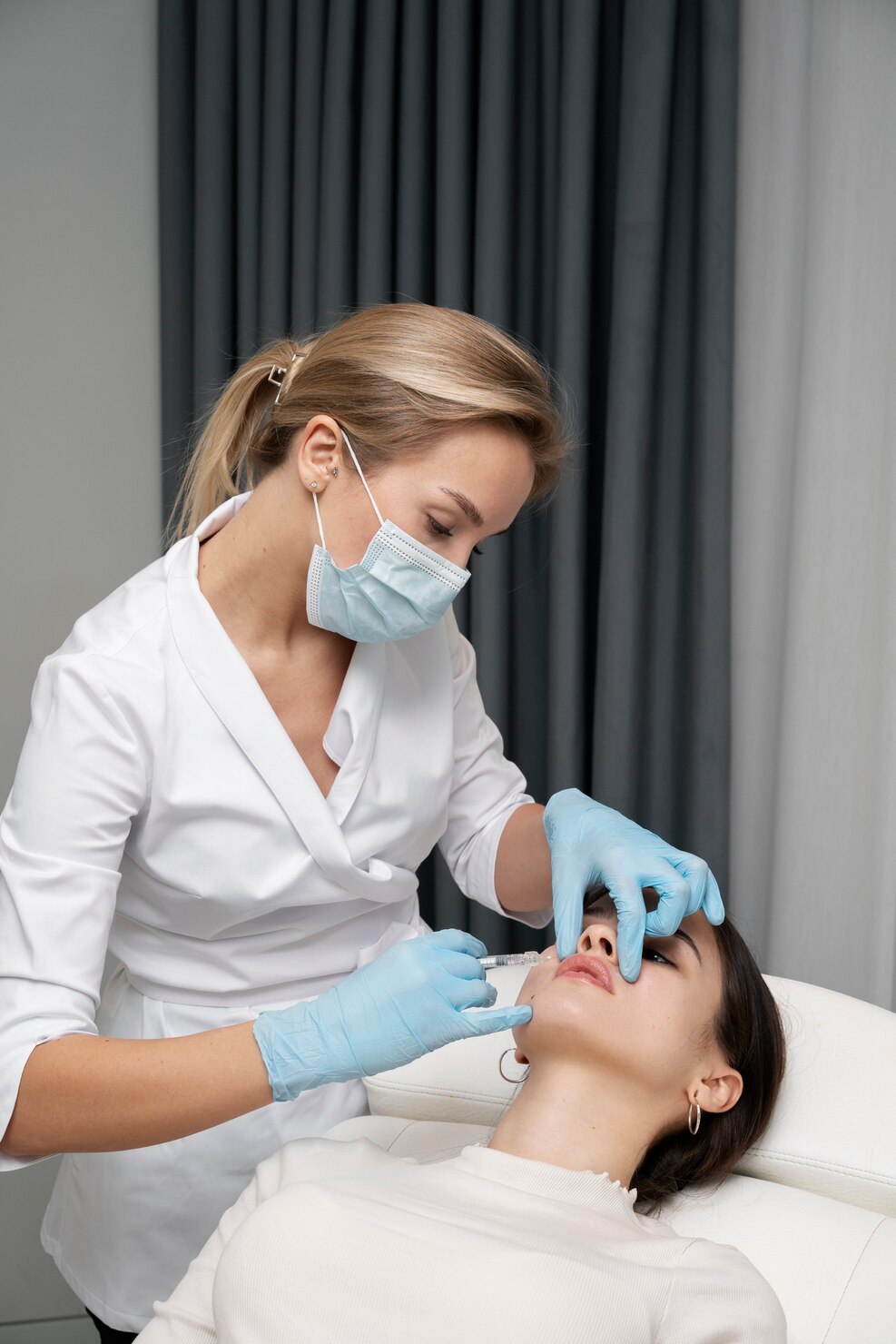 Woman receiving a professional lip filler treatment at a cosmetic clinic