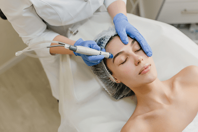 Patient receiving a non-invasive facial rejuvenation treatment for healthier-looking skin.