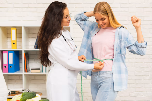 Nutritionist providing weight loss assessment and wellness consultation.