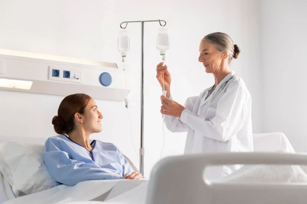 Provider checking a patient before IV hydration therapy